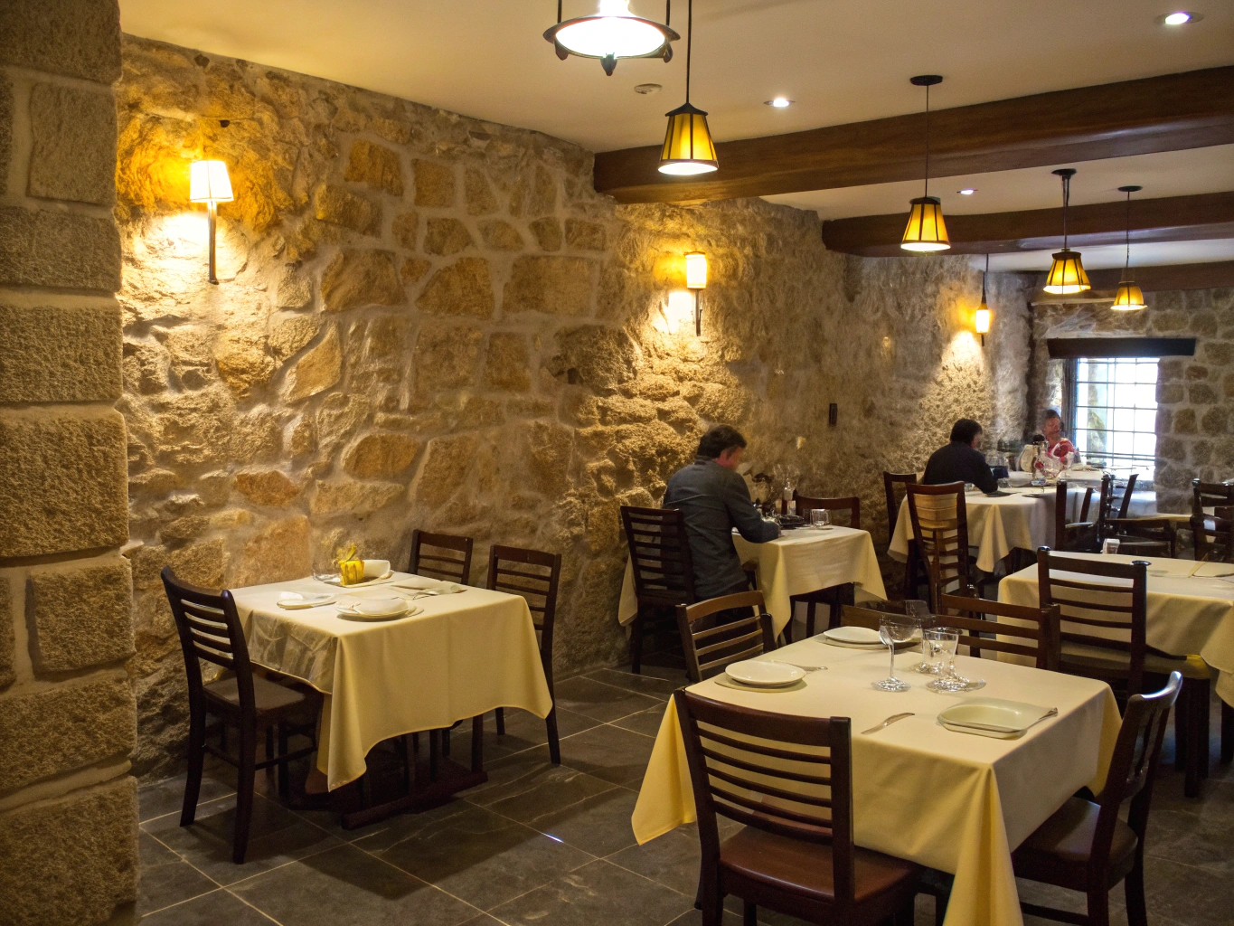 Cozy dining atmosphere with warm lighting and wood accents